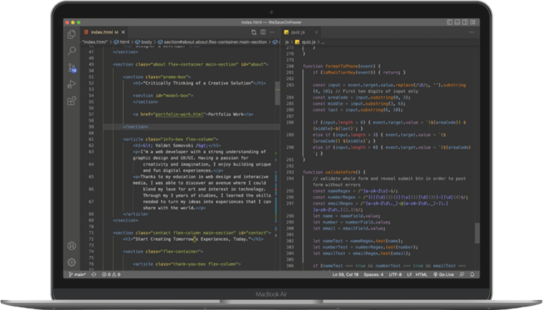 A laptop with some code displayed on the screen.